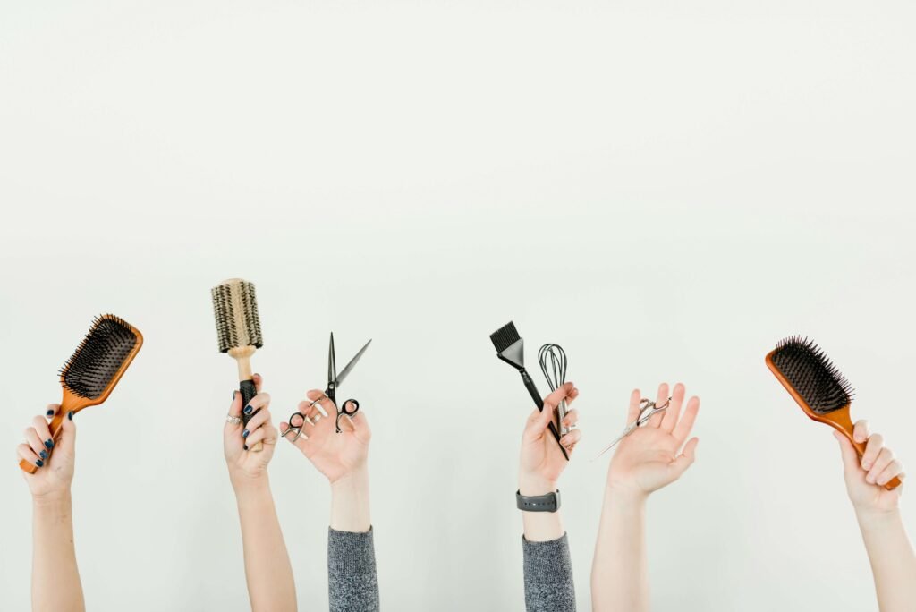 hands with brushes and scissors